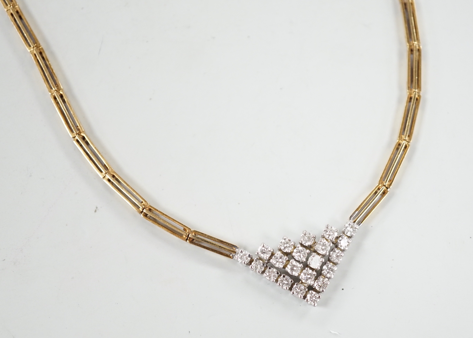 A modern 14kt yellow metal gold diamond cluster set V shaped necklace, approx. 40cm, gross weight 19 grams.